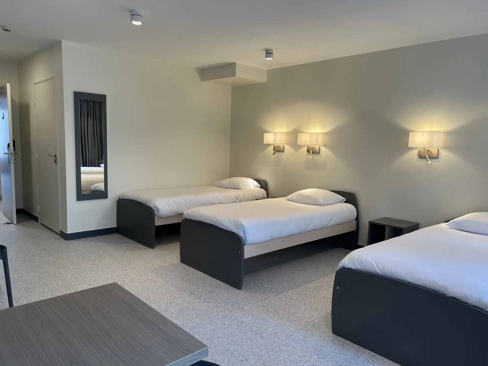 Chambre triple de l'hôtel d'application